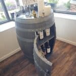 Custom whiskey barrel mini bar at ablaze design group showroom