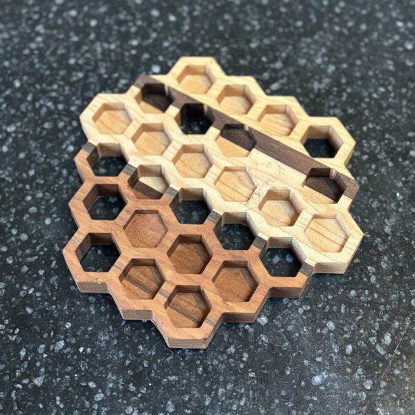 Hand crafted honey comb shaped natural walnut, maple and charry wood combination coasters